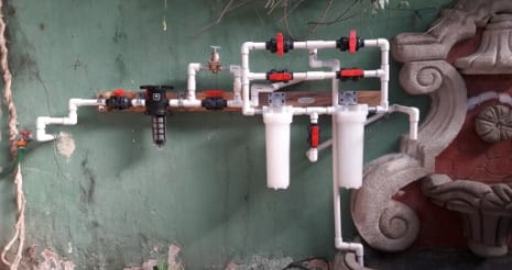 A Village Facility Filter installed into an existing plumbing system