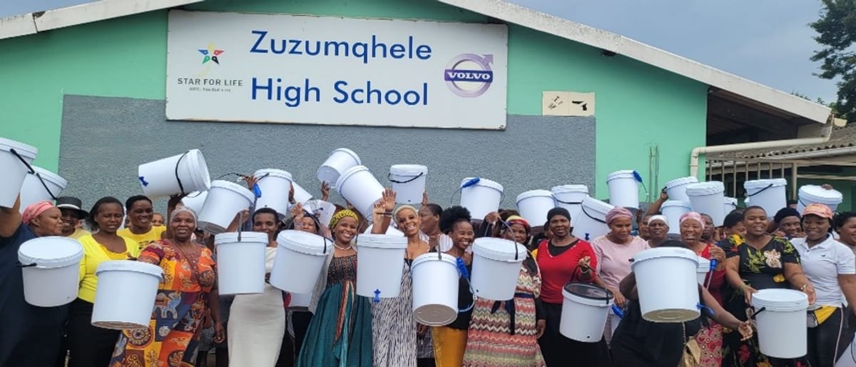 Learners and staff gathered outside Zuzumqhele High School with their filter buckets