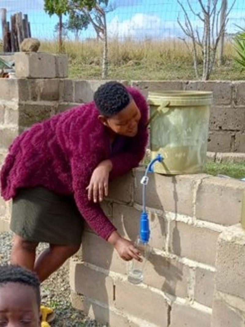 Clean water running from a filter fitted to a tap
