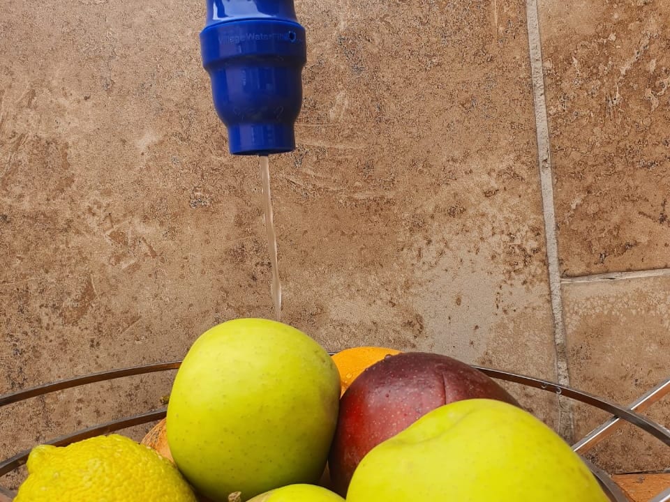 Fresh fruit being rinsed under filtered water